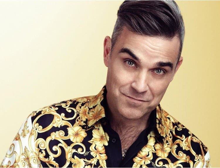 Robbie Williams vydá svoj prvý vianočný album. Prizval si naň zvučné mená